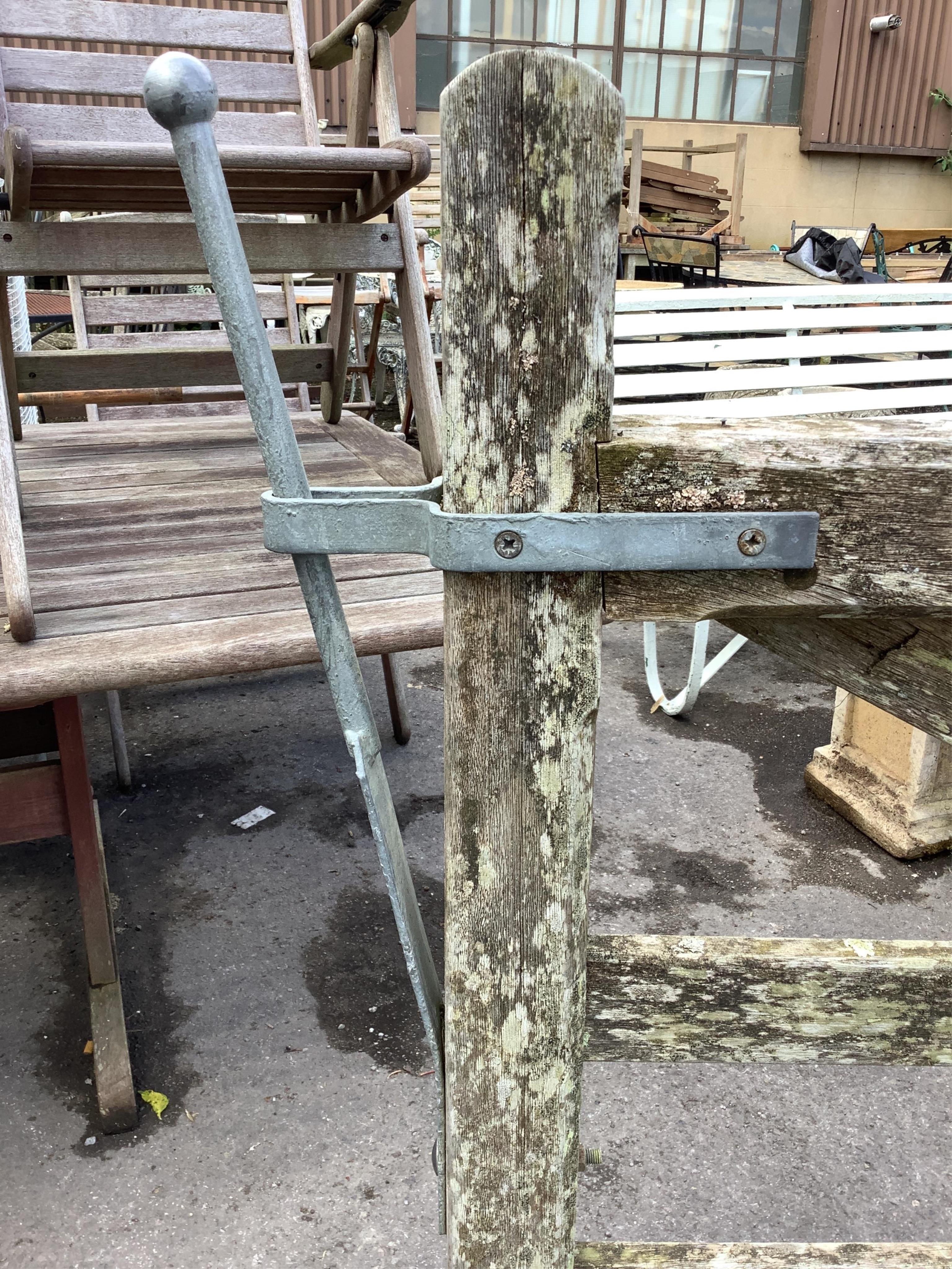 A pair of 12ft Biddenden hardwood gates with galvanised mounts. Condition - poor to fair